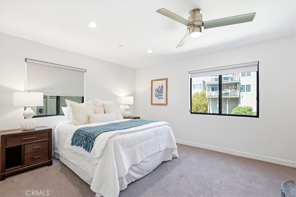 Spacious bedroom featuring contemporary finishes, abundant natural light, and a relaxing atmosphere. - 33871 Calle La Primavera, Dana Point CA 92629 - photo 35