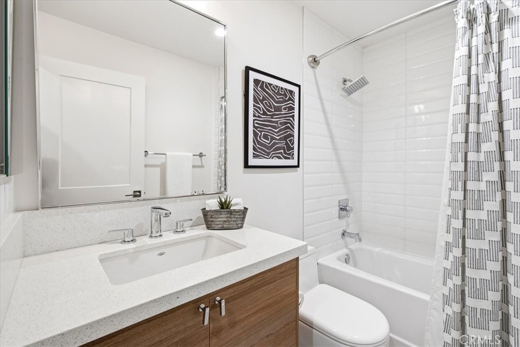 Well-appointed bathroom with modern fixtures, ample vanity space, and a clean contemporary design. - 33871 Calle La Primavera, Dana Point CA 92629 - photo 38
