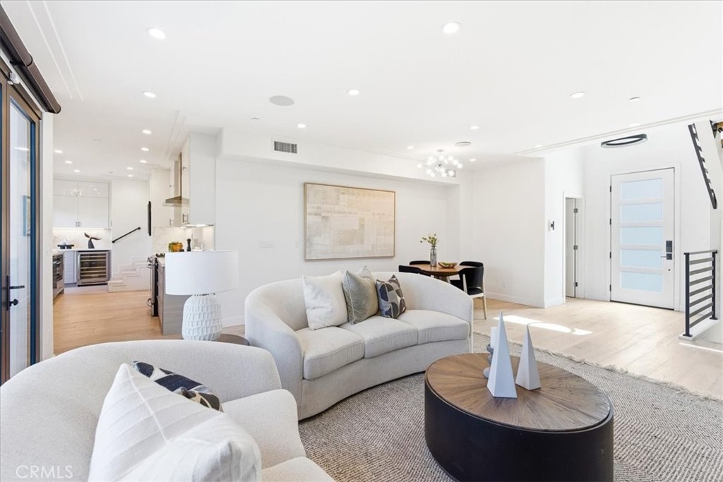 Open living room with a sectional and natural light. - 33871 Calle La Primavera, Dana Point CA 92629 - photo 3