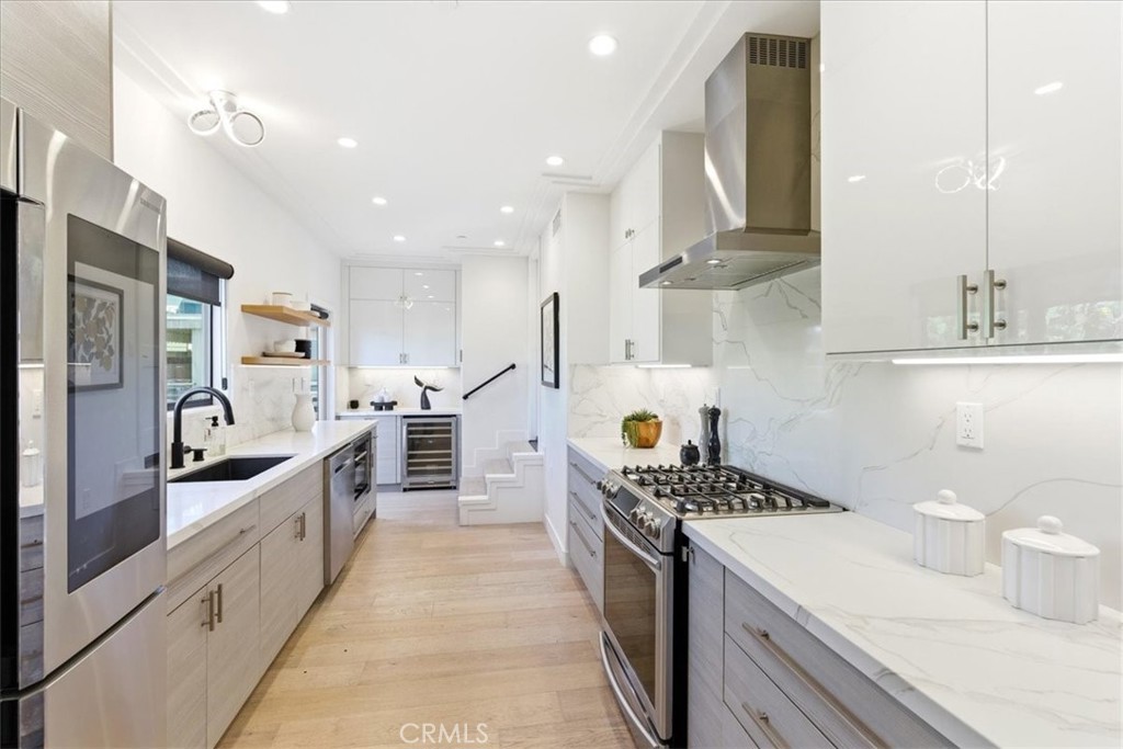 Kitchen with stainless appliances and a long counter. - 33871 Calle La Primavera, Dana Point CA 92629 - photo 8