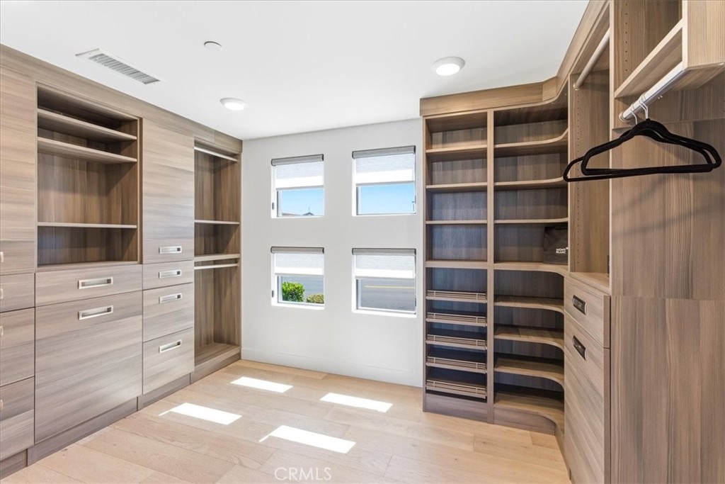 Walk-in closet with custom built-in shelving. - 33871 Calle La Primavera, Dana Point CA 92629 - photo 13