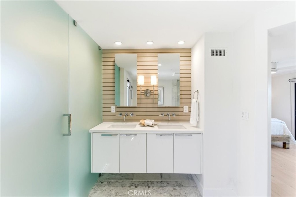 Bathroom with a floating vanity and frosted glass shower. - 33871 Calle La Primavera, Dana Point CA 92629 - photo 16