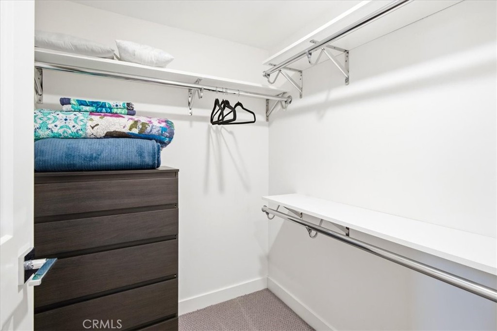 Walk-in closet with built-in storage. - 33871 Calle La Primavera, Dana Point CA 92629 - photo 27