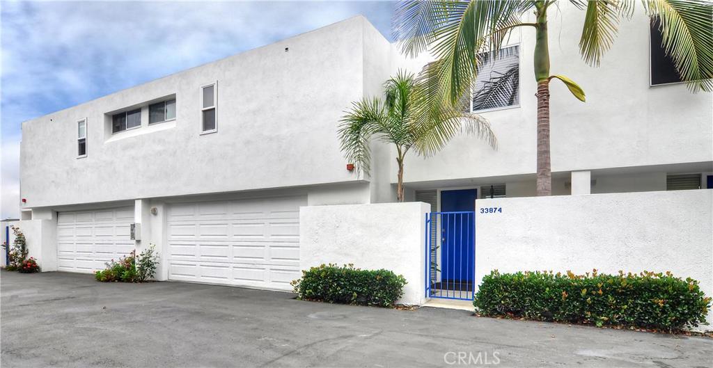 Front gated courtyard entry and direct access two car garage. - 33874 Copper Lantern Street, Dana Point CA 92629 - photo 1