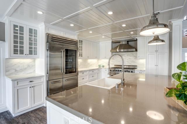 Kitchen with Sub-Zero Refrigerator, Viking stove & Wine Fridge, Imported Carrera marble counters, Caesar Stone island - 33887 Cape Cove, Dana Point CA 92629 - photo 1