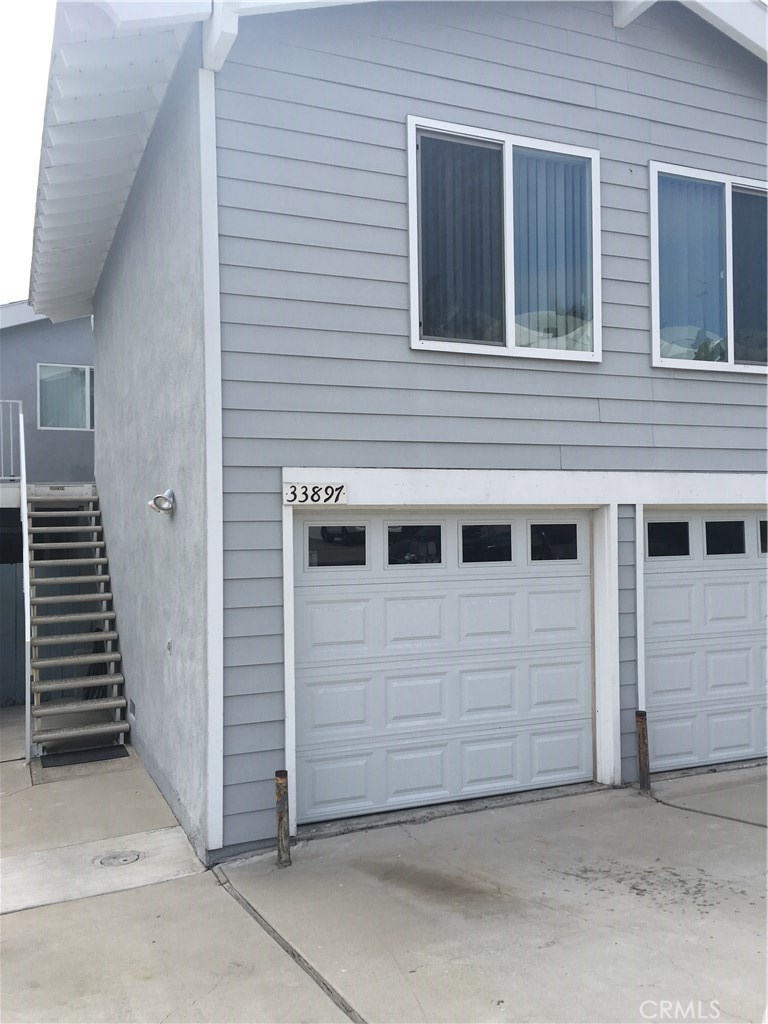 Stairs to the apartment over the garage. - 33897 Copper Lantern, Dana Point CA 92629 - photo 1