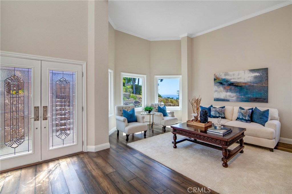 Beautiful leaded glass doors and wood framed windows allow plenty allow light and ocean view. - 33901 Calle La Primavera, Dana Point CA 92629 - photo 1