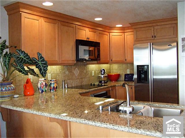 Remodeled Gourmet Kitchen, granite counter tops, stainless steel appliances. - 33901 MARIANA Drive 8, Dana Point CA 92629 - photo 1