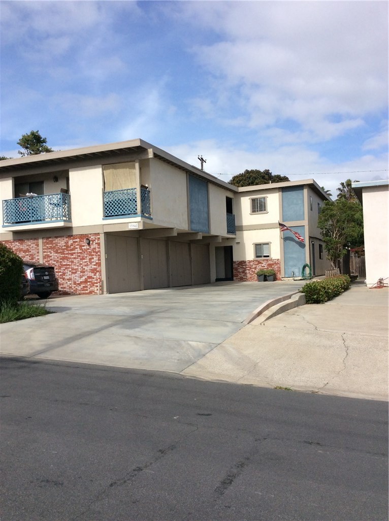 More pictures coming soon. Picture of the front of the building. Unit is in the side back area. - 33942 Amber Lantern Street C, Dana Point CA 92629 - photo 1