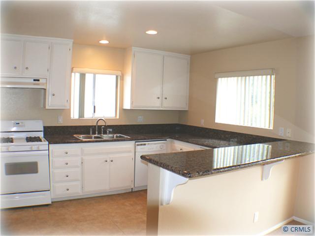 GRANATE-COUNTERS-IN-LARGE-KITCHEN - 33972 ALCAZAR Drive D, Dana Point CA 92629 - photo 1