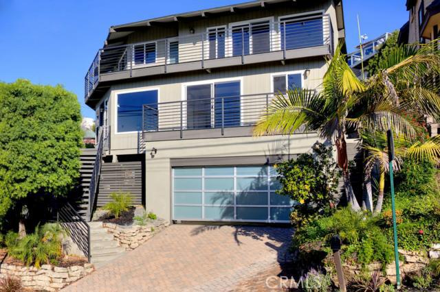 Front of home with wrap around view decks on top floor. - 33972 Crystal Lantern Street, Dana Point CA 92629 - photo 1