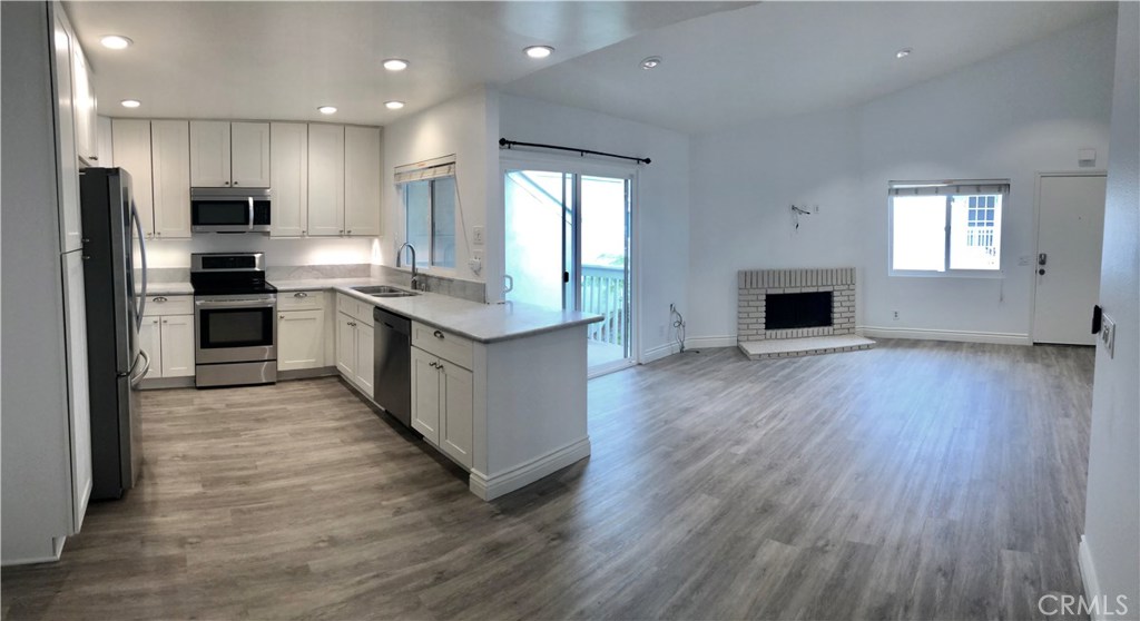 Gorgeous new flooring and light/bright cabinetry! Coastal elegance.... - 34002 Selva Road 371, Dana Point CA 92629 - photo 1