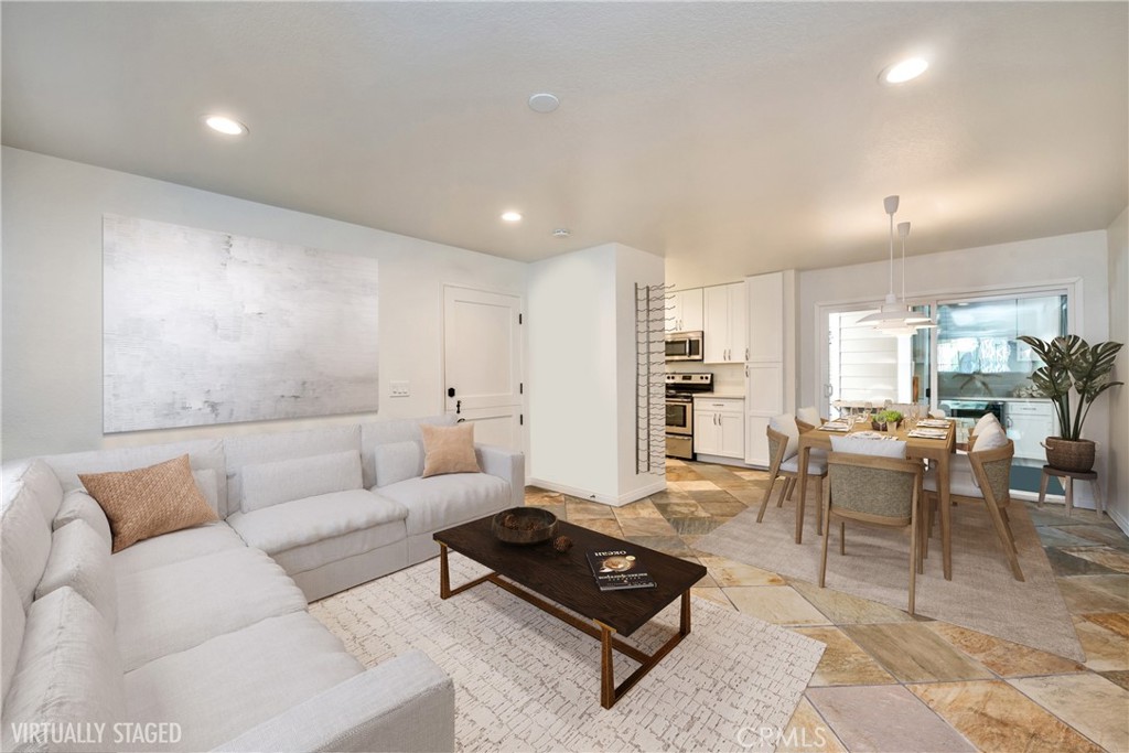 Virtually staged living view into living room. - 34022 Selva Road 52, Dana Point CA 92629 - photo 1