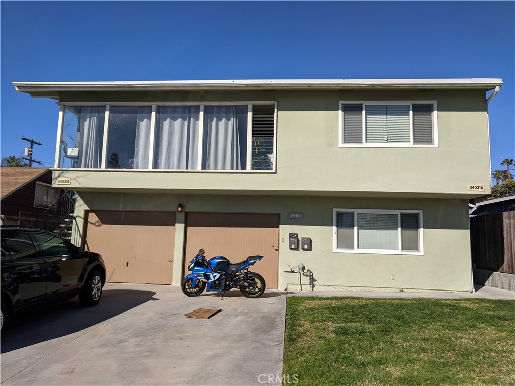 Bottom unit on the right with parking spot on left side of driveway and in single garage on the left. - 34031 La Serena Dr, Dana Point CA 92629 - photo 1