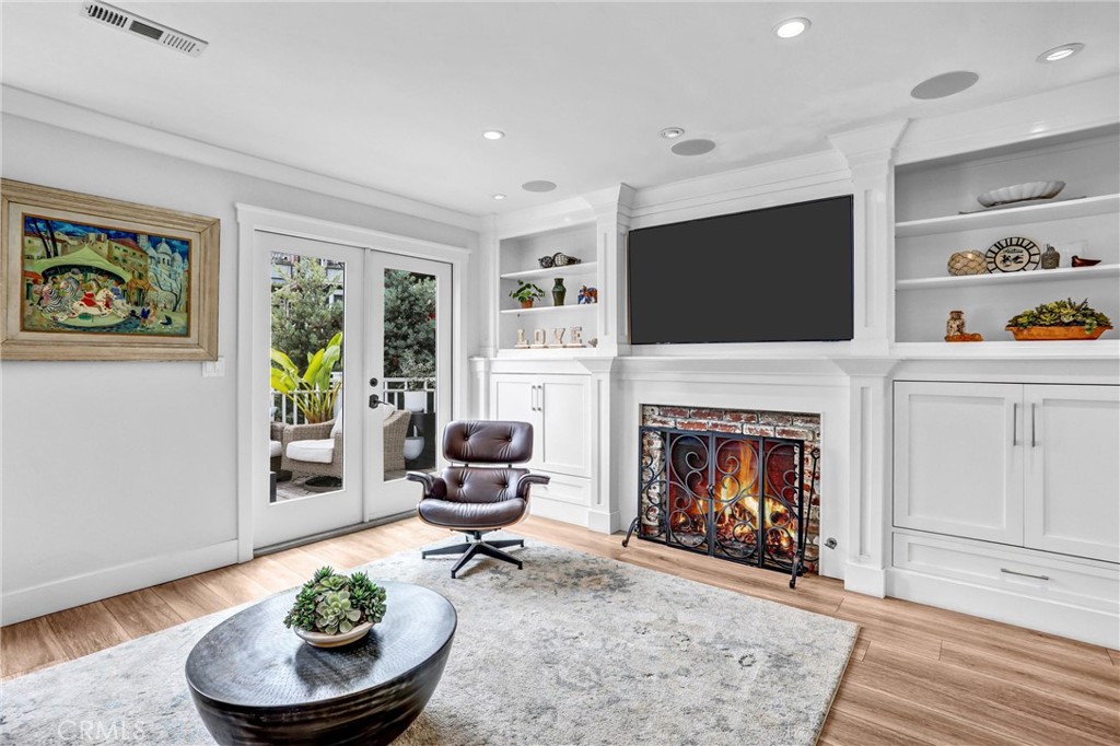 Light and bright living room, fire has been added digitally to photo. - 34032 Crystal Lantern, Dana Point CA 92629 - photo 5