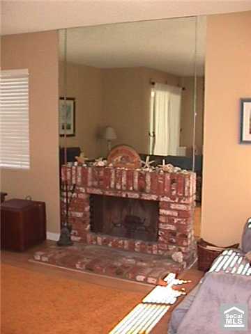 COZY BRICK LIVING ROOM FIREPLACE - 34112 SELVA Road 332, Dana Point CA 92629 - photo 1