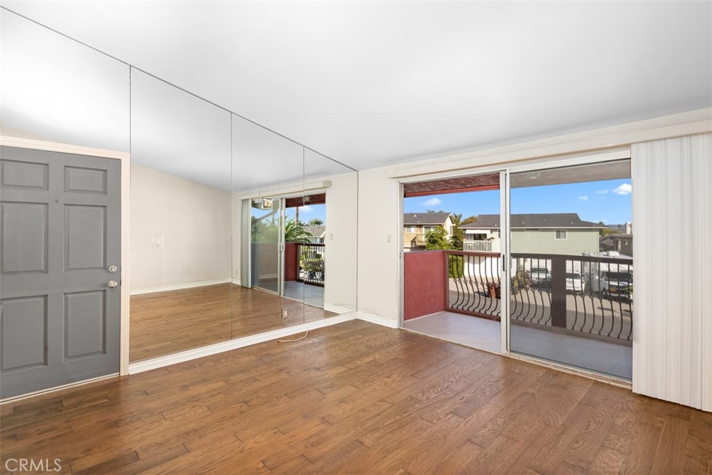 Solid front door, consistent wood flooring - 34121 Ruby Lantern A, Dana Point CA 92629 - photo 8