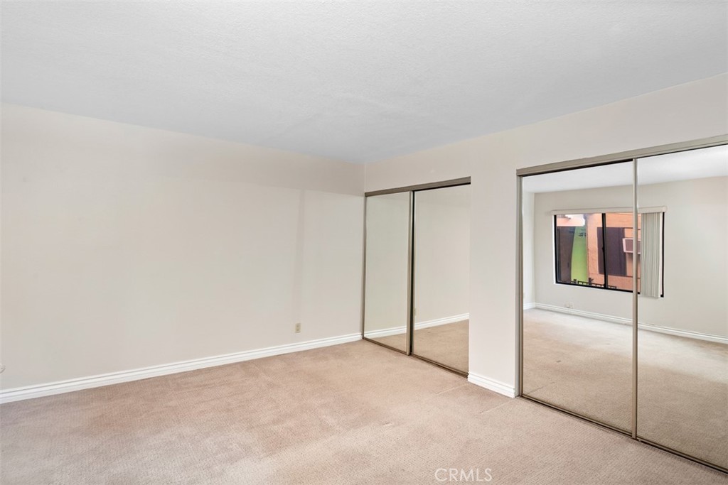 Spacious Bedroom with mirrored closets doors - 34121 Ruby Lantern A, Dana Point CA 92629 - photo 16