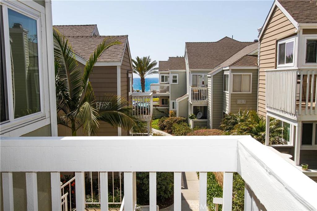 Water view from patio accessible by secondary bedroom and living room. - 34138 Selva Road 225, Dana Point CA 92629 - photo 1