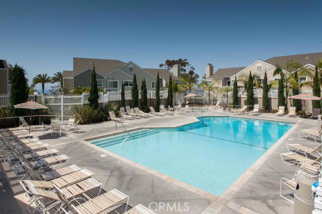Community pool….take a dip and catch some rays just steps from the sand and water at Strands Beach! - 34144 Selva Road 202, Dana Point CA 92629 - photo 1
