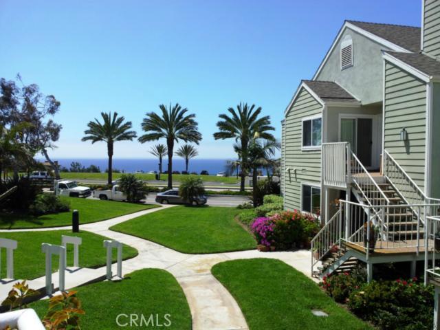 Ocean is across thes street from this highly desirable Niguel Beach Terrace community. View from pool area. - 34152 Selva Road 176, Dana Point CA 92629 - photo 1