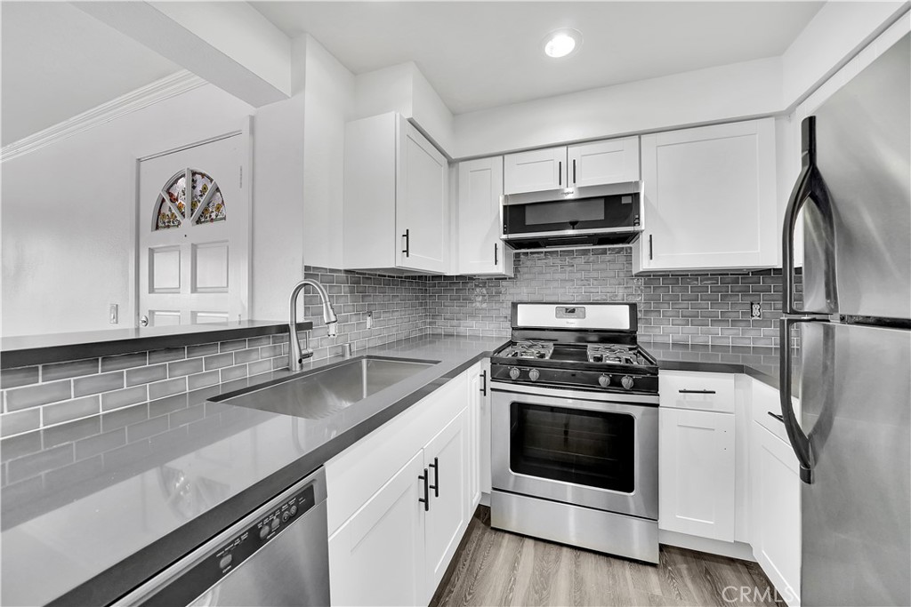 Brand new stylish kitchen - sleek design! - 34264 Camino Capistrano 114, Dana Point CA 92624 - photo 1
