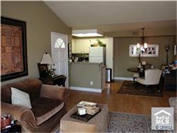 Top Floor! Living room with vaulted ceilings & custom paint throughout - 34264 CAMINO CAPISTRANO 314, Dana Point CA 92624 - photo 1
