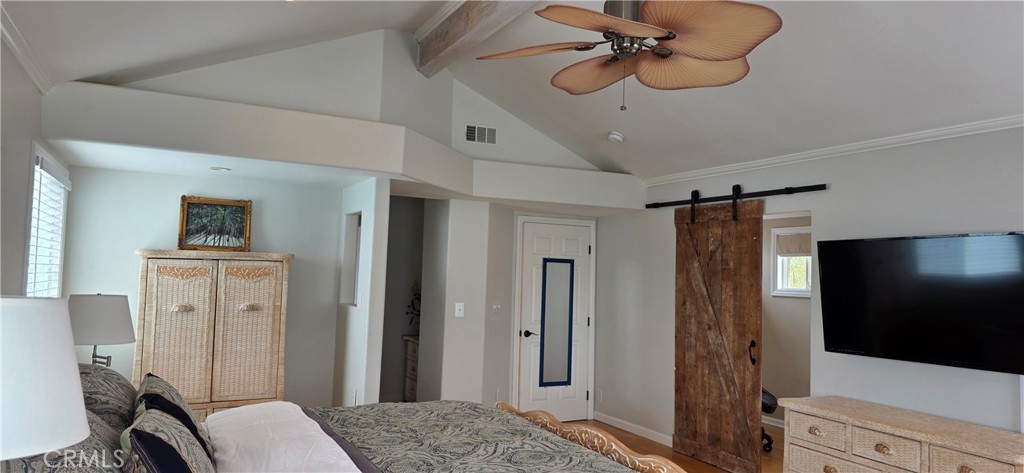 Primary Suite with Vaulted Ceiling and Large Smart TV, Opens to Separate Office behind barn door - 34271 Via Lopez, Dana Point CA 92624 - photo 16