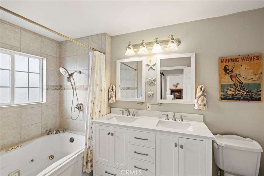 Ensuite Primary Bathroom with Double Sinks and Jetted Tub with Shower - 34271 Via Lopez, Dana Point CA 92624 - photo 21