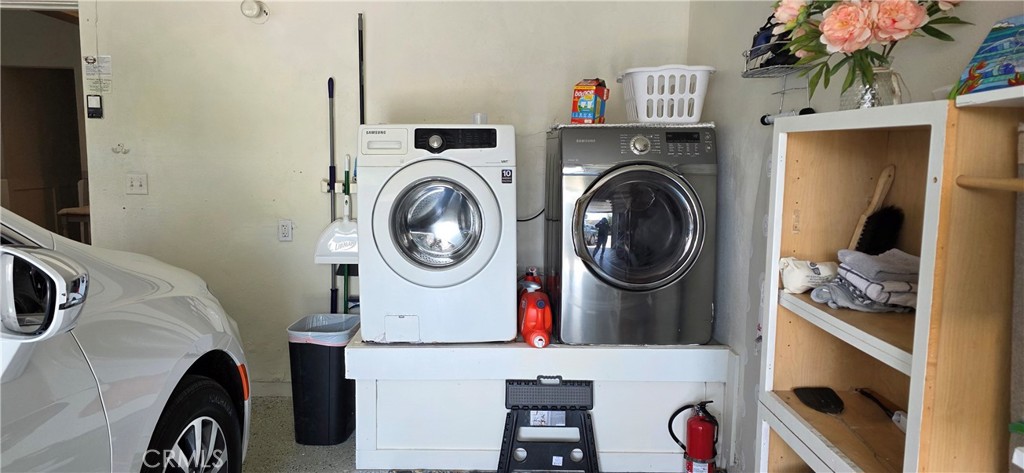 Laundry area in Garage with Large Capacity Washer and Dryer - 34271 Via Lopez, Dana Point CA 92624 - photo 26