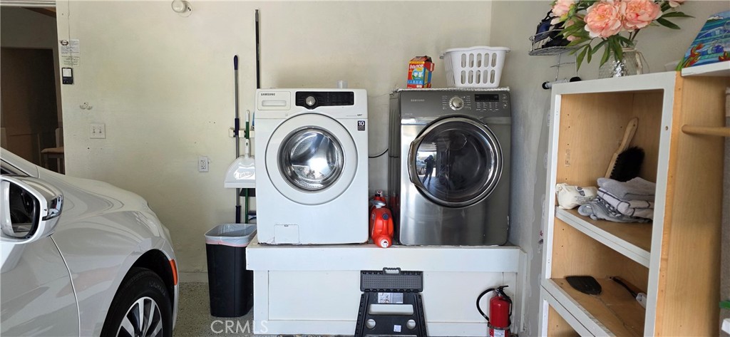 Laundry area in Garage with Large Capacity Washer and Dryer - 34271 Via Lopez, Dana Point CA 92624 - photo 27