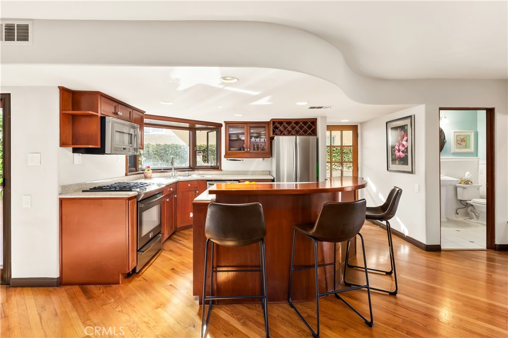 Fully equipped kitchen with large Quartz, SS Appliances. Bar Seating - 34283 Via Lopez, Dana Point CA 92624 - photo 9