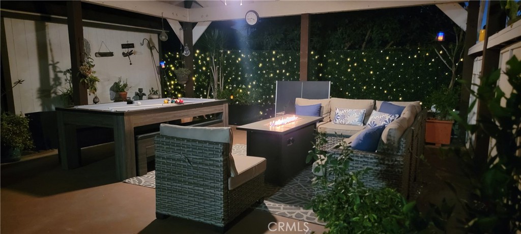 Closeup of covered 400 sq. ft carport/patio area wi/ pool/pingpong/dining table and firepirt sectional seating area with - 34283 Via Lopez, Dana Point CA 92624 - photo 18