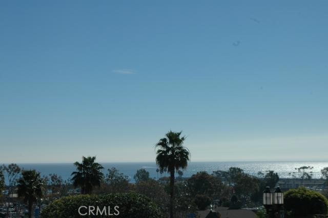 Front row stunning majestic ocean views from balcony which is fabulous for entertaining or relaxing!!! - 34300 LANTERN BAY Drive 5, Dana Point CA 92629 - photo 1