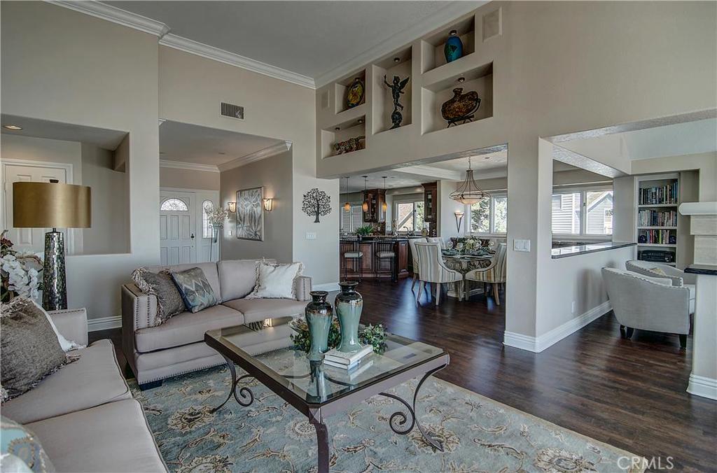 View of formal living room with dining room and kitchen in background - 34300 Lantern Bay Drive 50, Dana Point CA 92629 - photo 1
