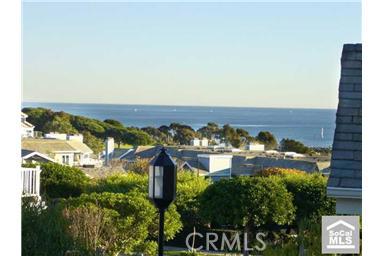 View sailboats & feel cool ocean breezes from wrap-around Veranda - 34300 Lantern Bay Drive 71, Dana Point CA 92629 - photo 1