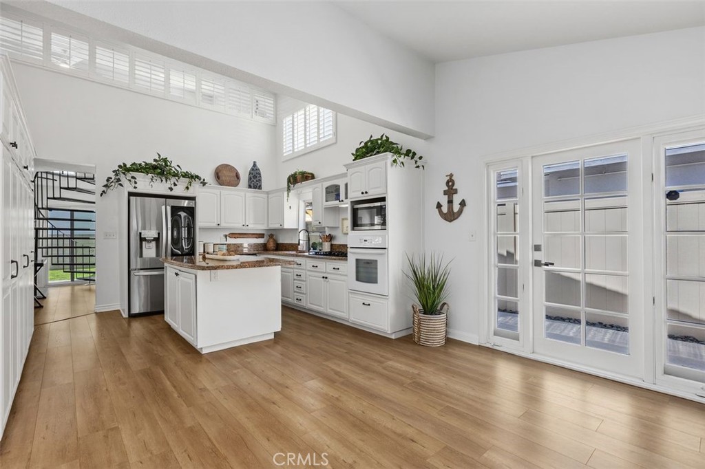 The kitchen is open so the living area. - 34355 Via San Juan, Dana Point CA 92624 - photo 14