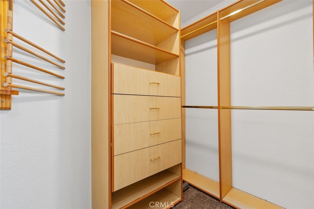 Walk in closet in the primary bedroom with built ins. - 34355 Via San Juan, Dana Point CA 92624 - photo 31