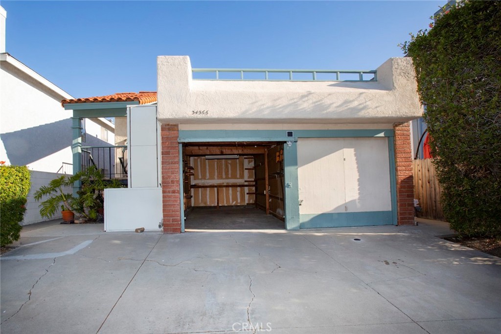 Upper unit B garage open, unit A garage closed - 34566 Via Catalina, Dana Point CA 92624 - photo 1