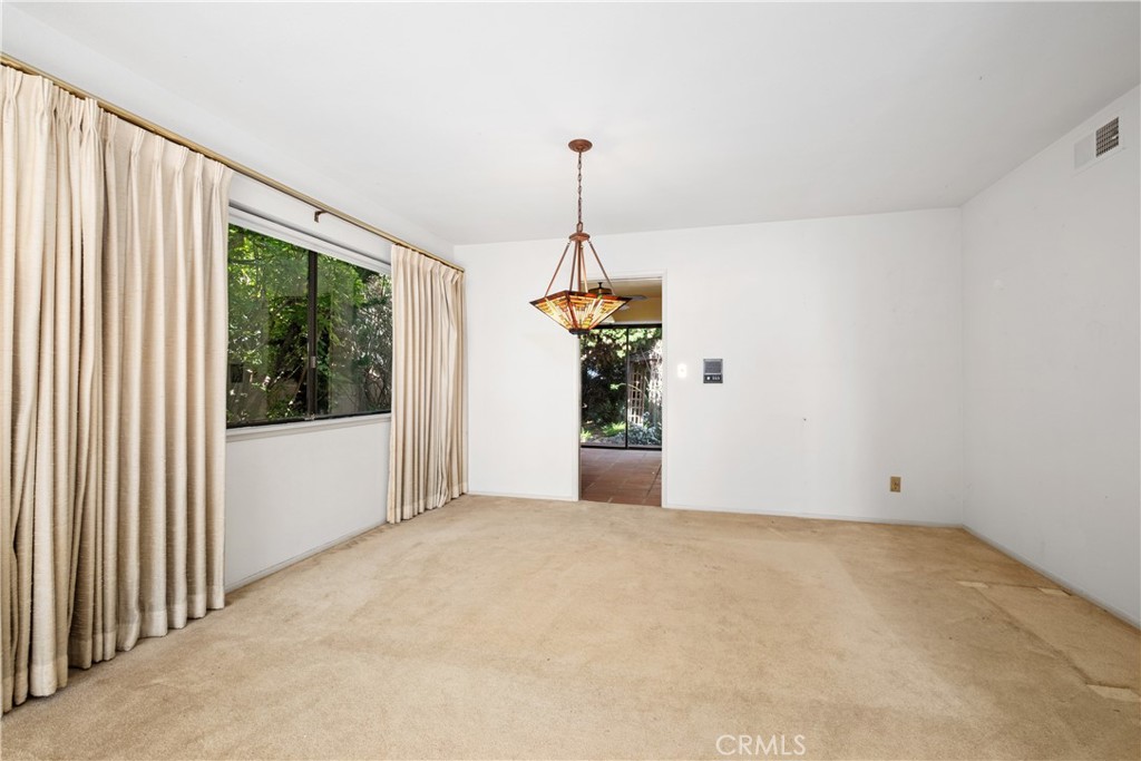 Formal dining room with access to kitchen and backyard. - 34866 Doheny Place, Dana Point CA 92624 - photo 14
