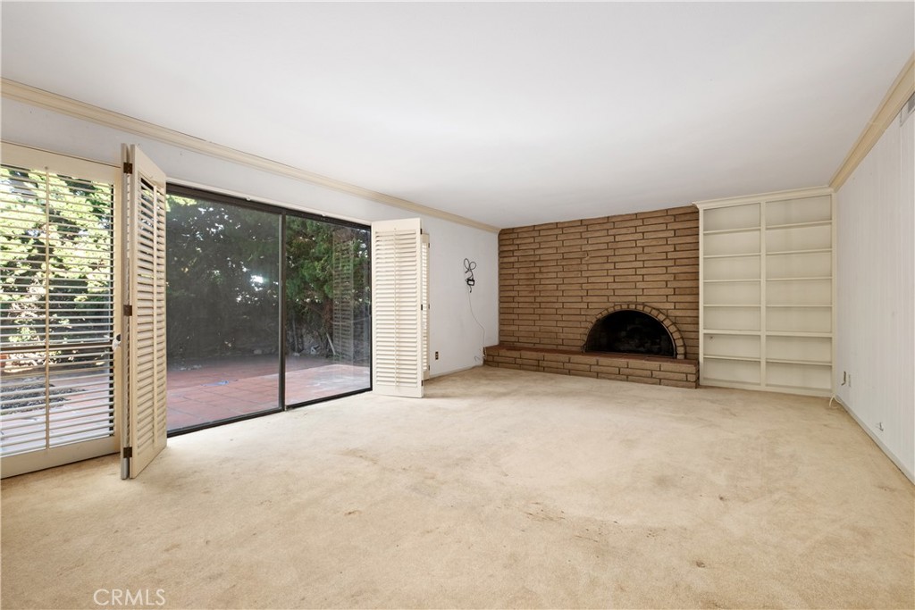 Family room w/fireplace and access to backyard - 34866 Doheny Place, Dana Point CA 92624 - photo 21