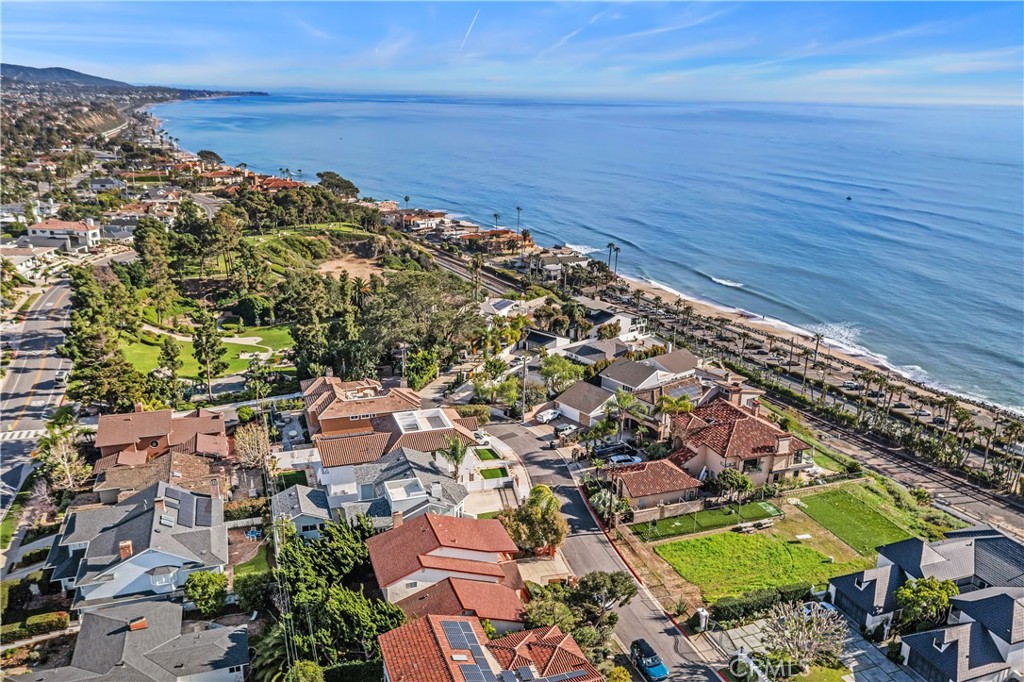 Drone view down the coast to San Clemente. - 34866 Doheny Place, Dana Point CA 92624 - photo 48