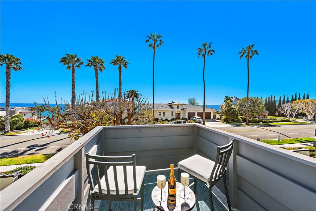 Gorgeous ocean & sunset view from the master suite balcony. - 35232 Camino Capistrano 6, Dana Point CA 92624 - photo 1