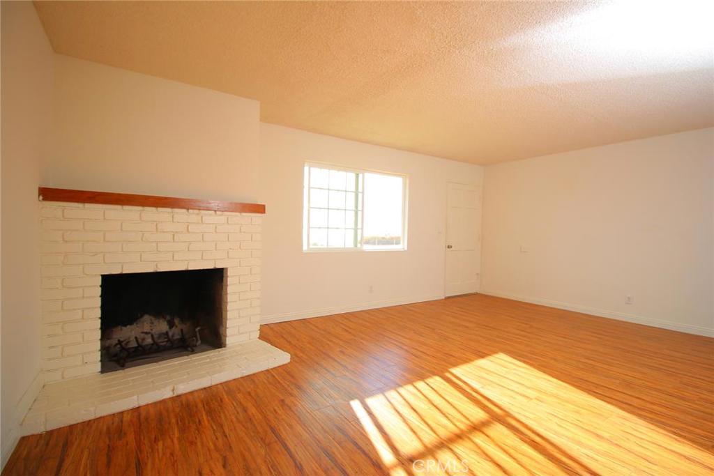 Living room with gas fireplace - 35476 Camino Capistrano A, Dana Point CA 92624 - photo 1