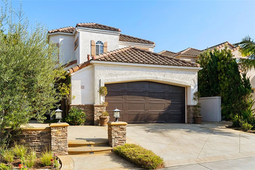 Gorgeous curb appeal showcasing beautiful hardscape, landscape and brand new garage doors! - 4 Duquesa, Dana Point CA 92629 - photo 1