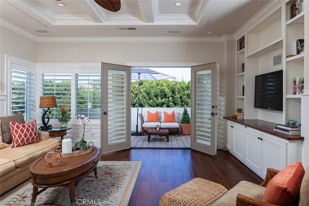 Great room with direct access to patio framed by lush landscape overlooking the 16th fairway - 4 Forest Hills Court, Dana Point CA 92629 - photo 1