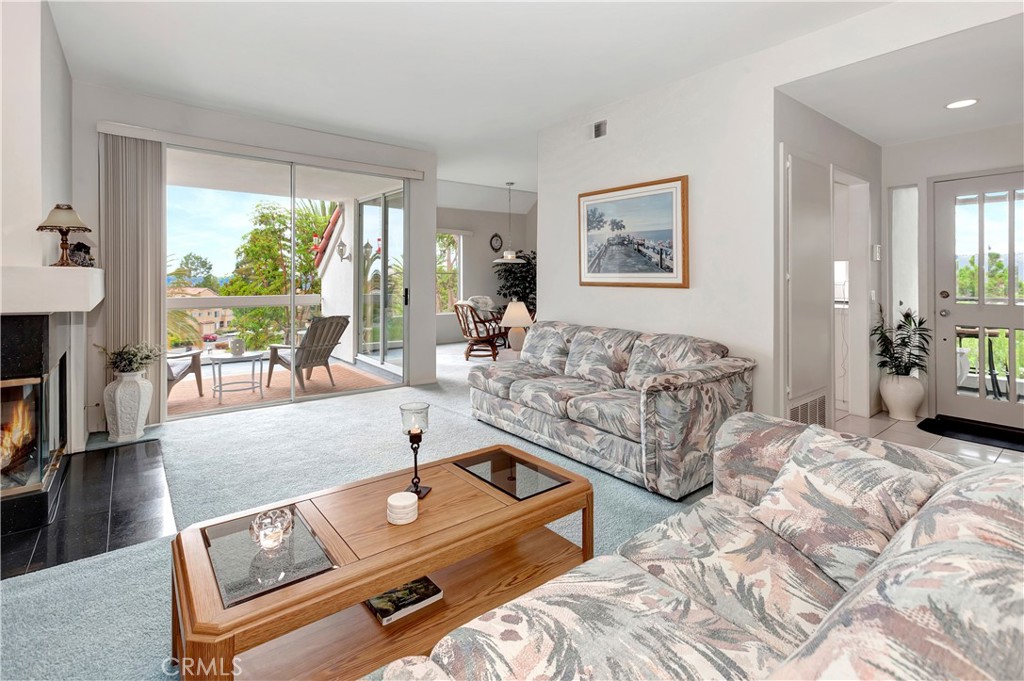 Spacious and open living room with lots of natural light and Cozy gas fireplace - 4 Vista Del Mar, Dana Point CA 92629 - photo 4