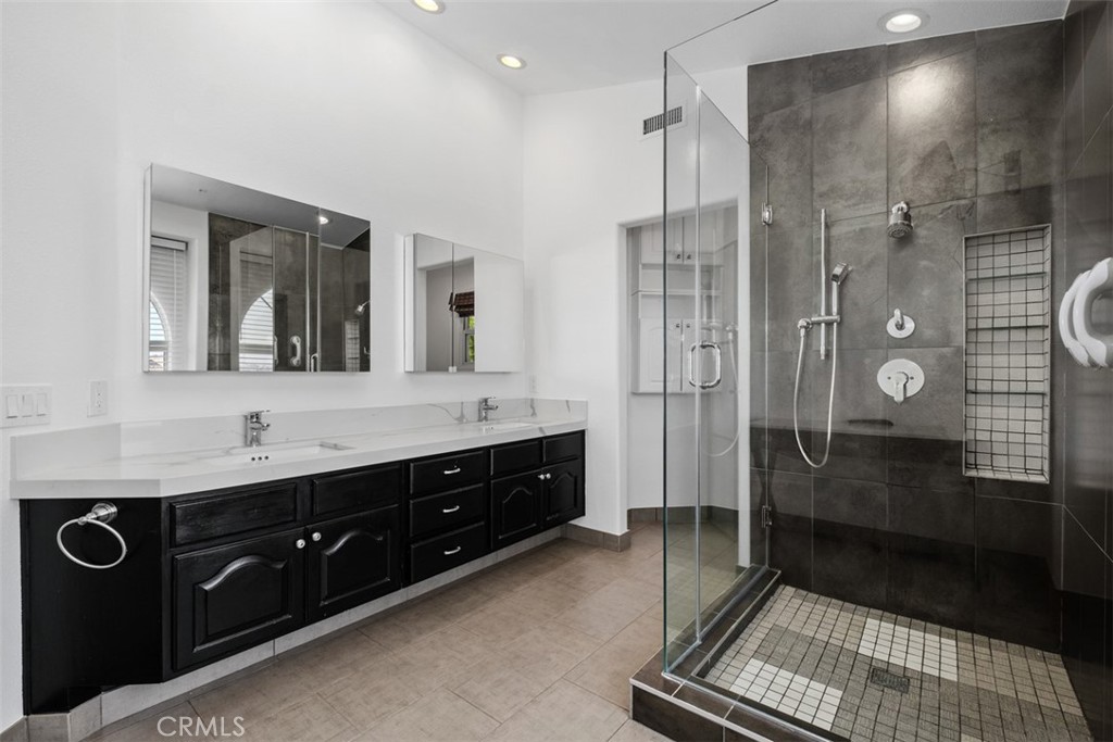 Primary bathroom with walk in shower and vanity - 41 Costa Del Sol, Dana Point CA 92629 - photo 21