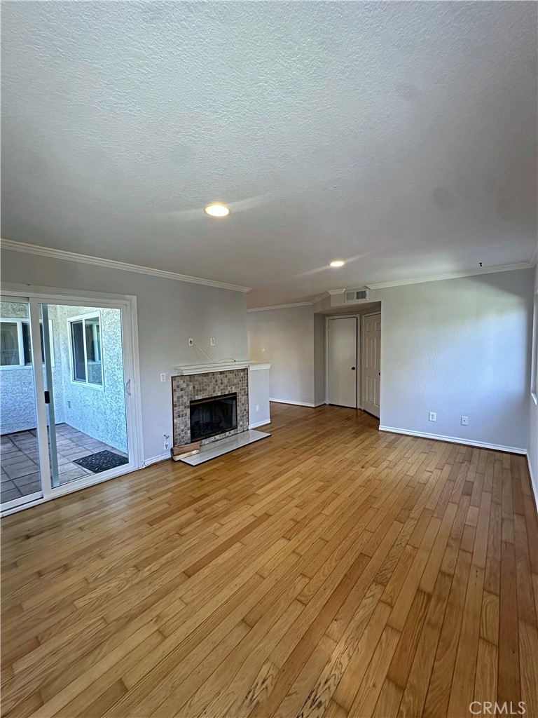 Light and bright family room with real wood floors and newly refinished fireplace. - 70 Corniche, Dana Point CA 92629 - photo 2