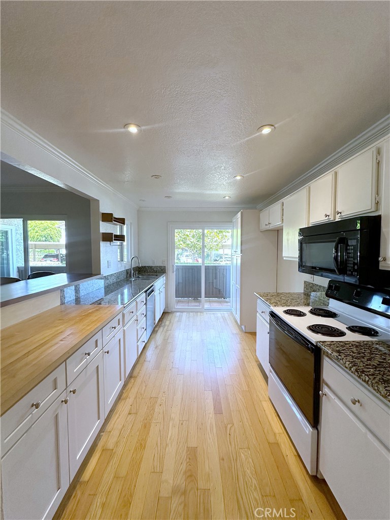 Kitchen flows to expansive patio - 70 Corniche, Dana Point CA 92629 - photo 7